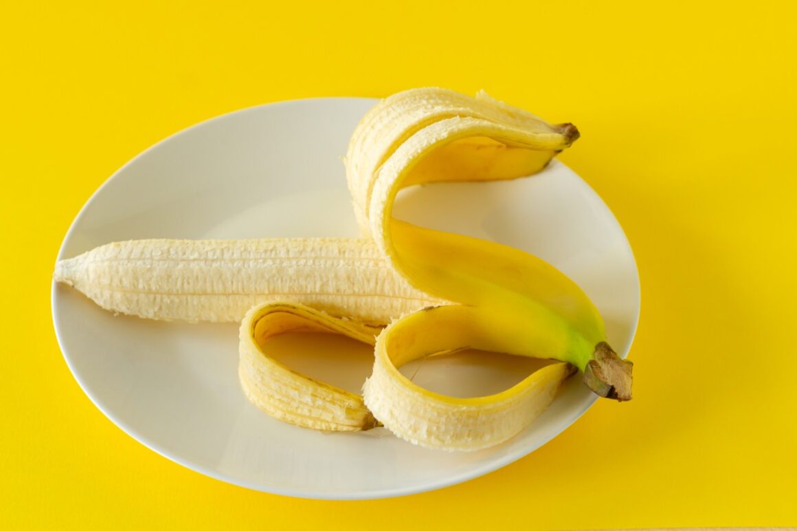 ripe peeled banana on a plate