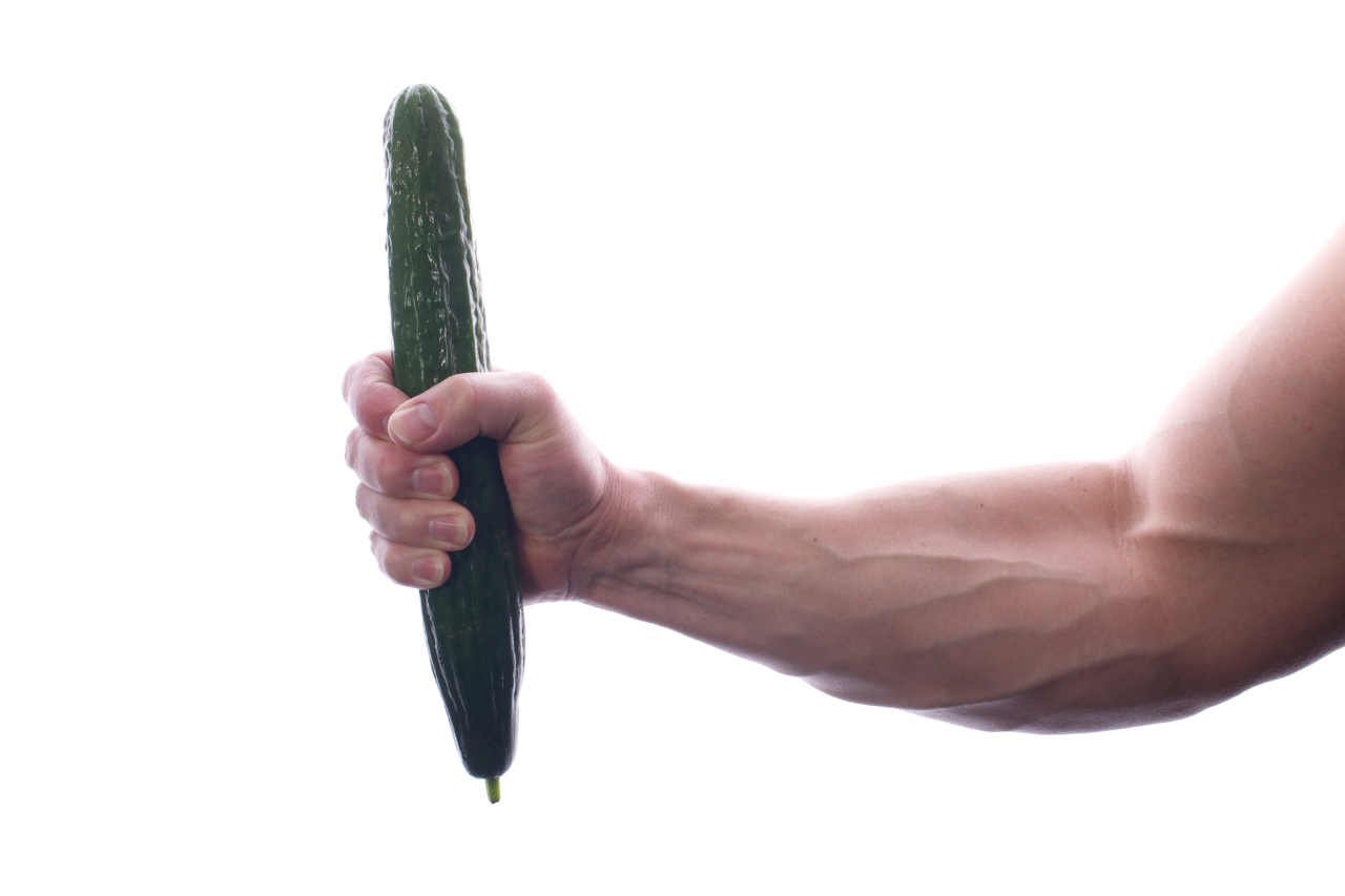 man holding a bitter gourd