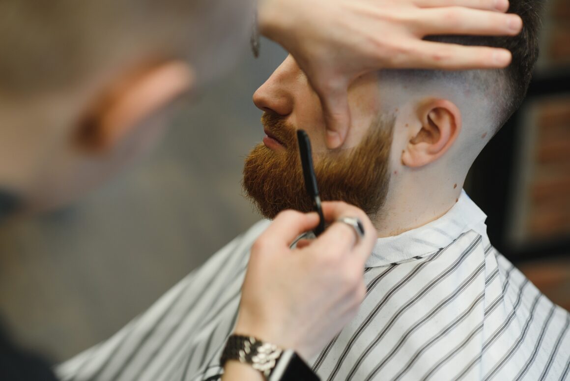 man getting a cut at the barber