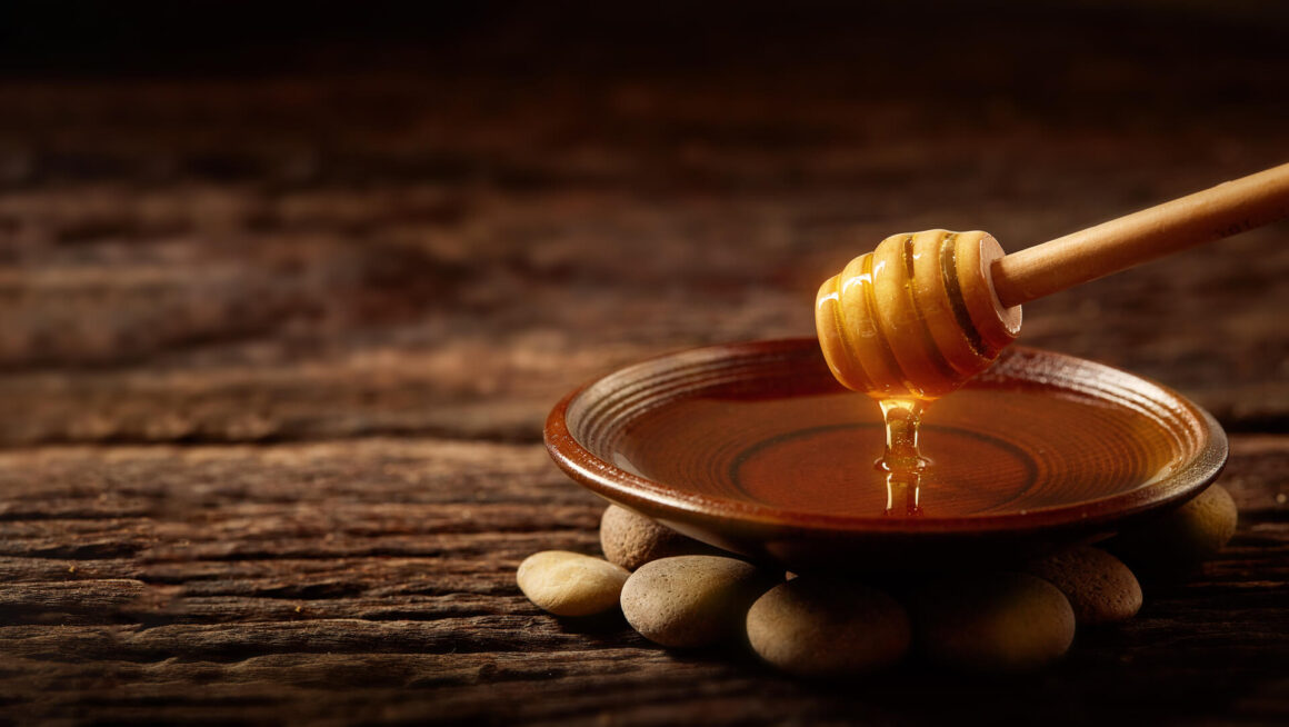 honey dripping into a plate