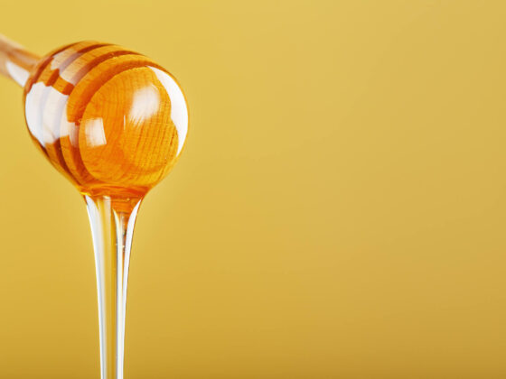 honey dripping from a spoon