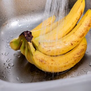 ripe bananas being washed