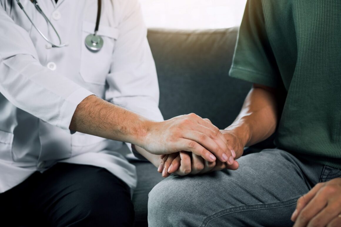 
Doctor is holding the hand of the patient by giving him confidence