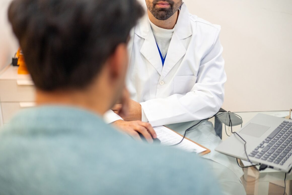 male patient speaking to a male doctor