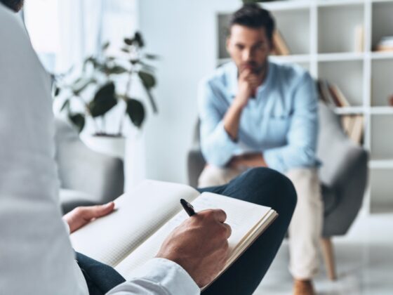 man consulting a therapist