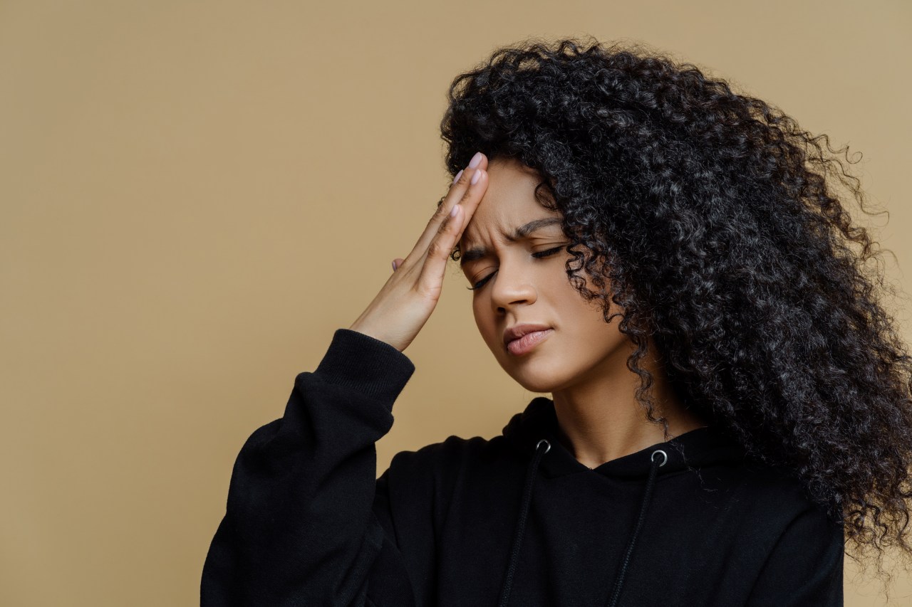 beautiful woman suffering from headache