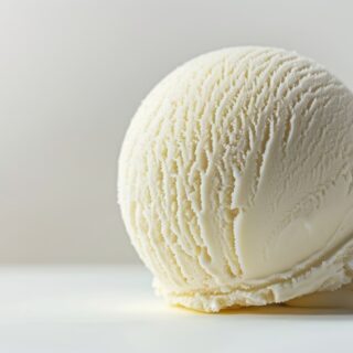 close up shot of a scoop of vanilla ice cream