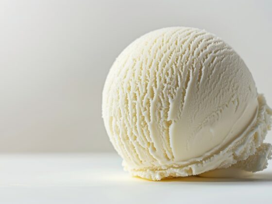 close up shot of a scoop of vanilla ice cream