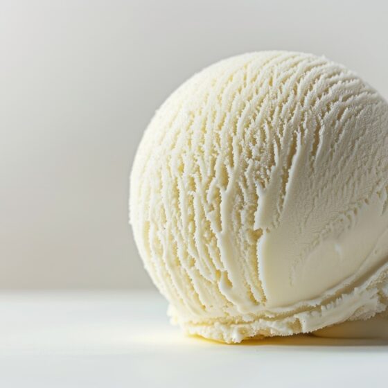 close up shot of a scoop of vanilla ice cream