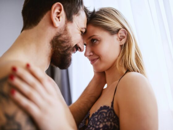 A man and his lady getting intimate in the bedroom