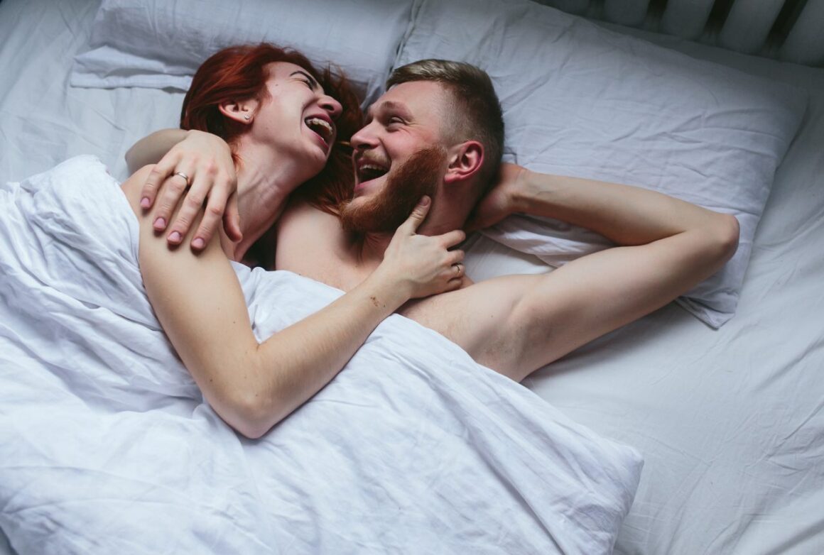 
Young couple in bed together