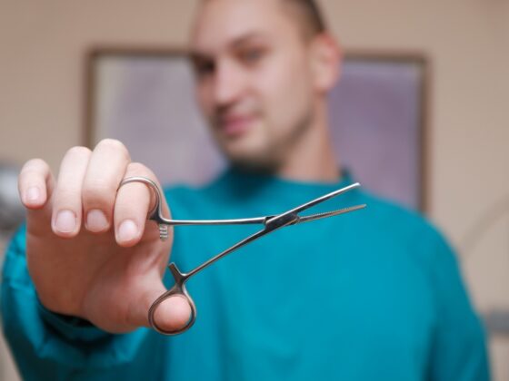 medical professional holding a medical tool