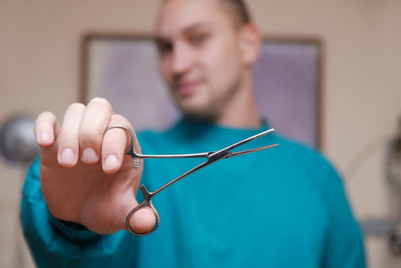 medical professional holding a medical tool