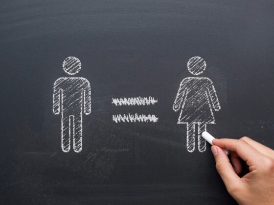 chalk drawing of a man and woman with equal sign in between