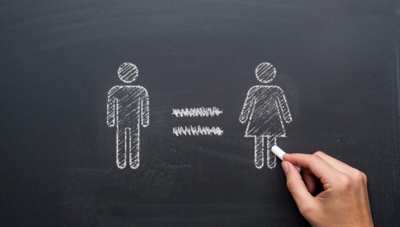 chalk drawing of a man and woman with equal sign in between