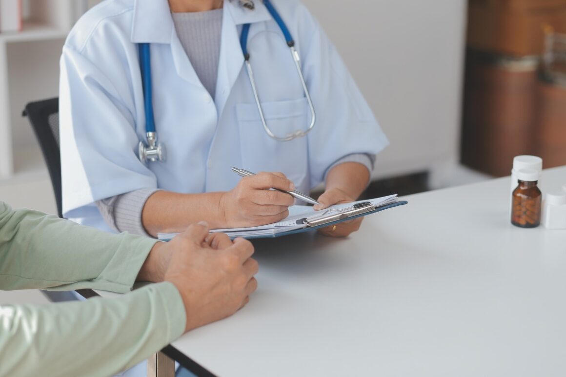 male doctor talking with his patient