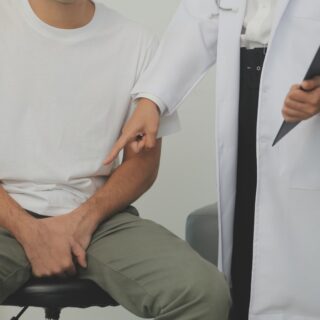 Man presses hands to his groin and suffering from pain