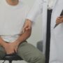 Man presses hands to his groin and suffering from pain